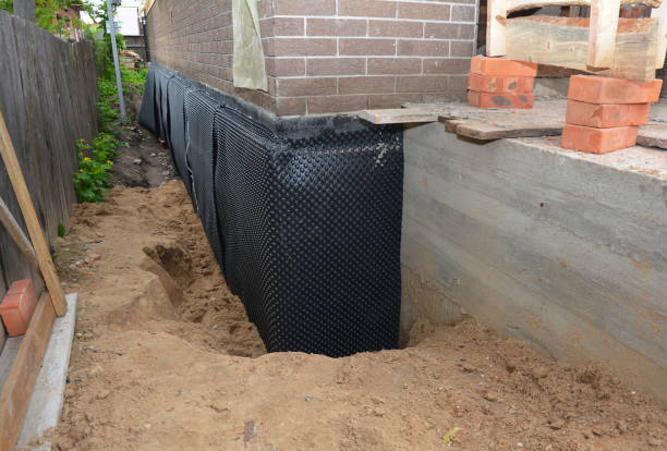 SJ Waterproofing Pros technician performing targeted Interior Drainage System assessment in Tazewell, VA